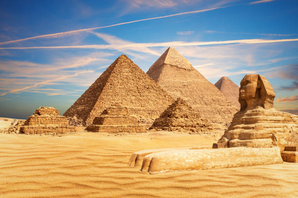 The Great Sphinx bythe Pyramids of Egypt and its companions in the sands of Giza desert, Egypt The Great Sphinx bythe Pyramids of Egypt and its companions in the sands of Giza desert, Egypt. great pyramid of khufu stock pictures, royalty-free photos & images