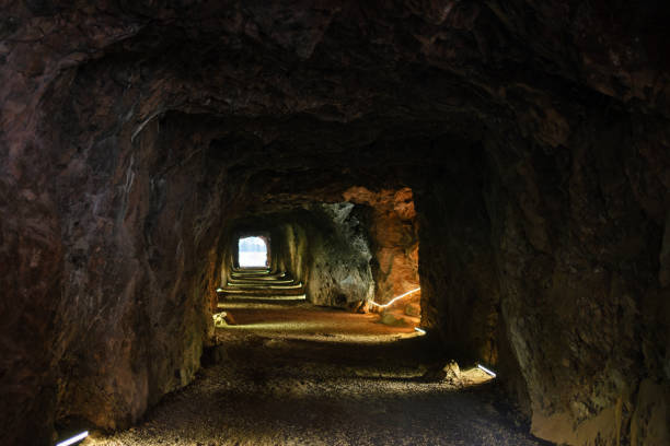 istock Dimly lit depths of an underground tunnel within a mine shaft 2145729129