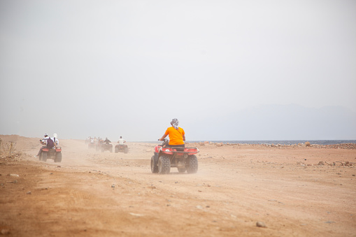 Sharm El Sheikh, Egypt- March 14, 2024
Tourists on ATV safari in the desert.