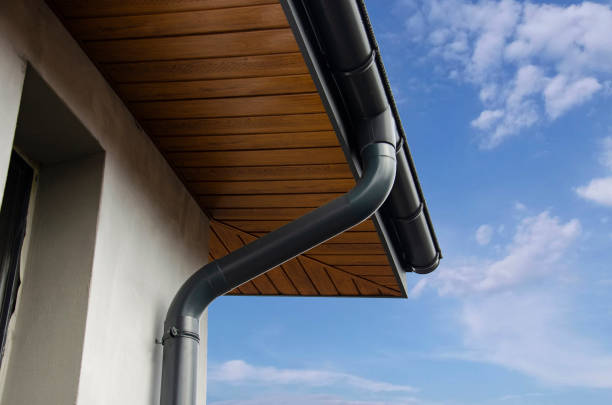 istock Gray metal rain gutter system and corner on house 2145788231