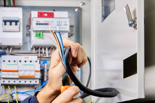 istock Removing outer sheath of PVC insulation from  power cable for connection to switchboard. 2145846499