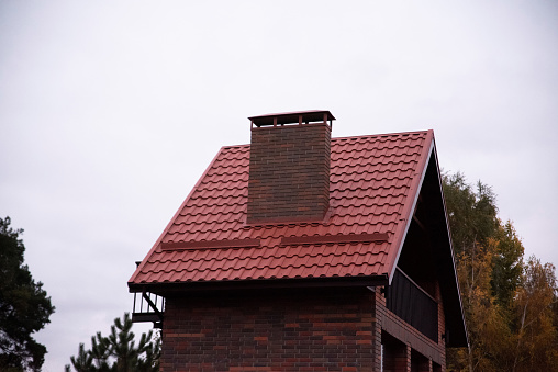 House with a terracota metal roof tile