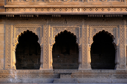 24 February 2024, Exterior View of the scenic tourist landmark Maheshwar fort (Ahilya Fort) in Madhya Pradesh, India, Beautiful Sculptures and Carving details on the outer wall.