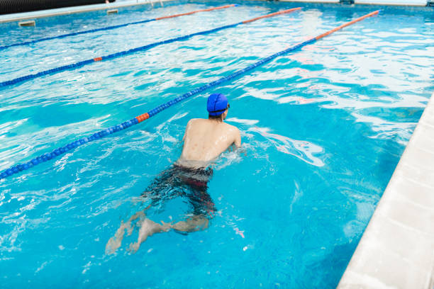 istock Young man with scars on his back in the swimming pool 2145908318