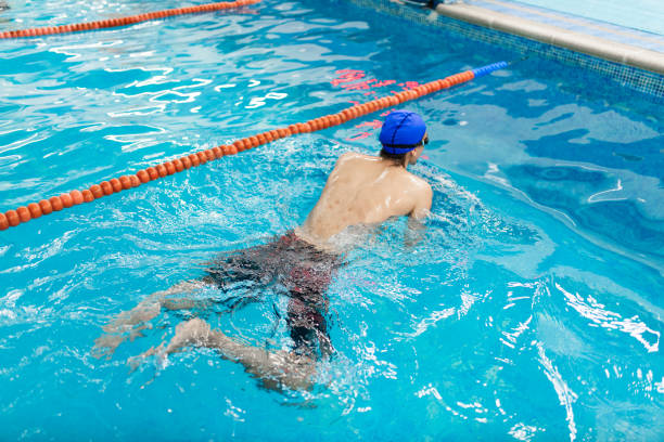 istock Young man with scars on his back in the swimming pool 2145908329