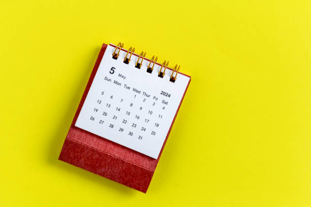 istock Desktop calendar for May 2024 on a yellow background. 2145958404