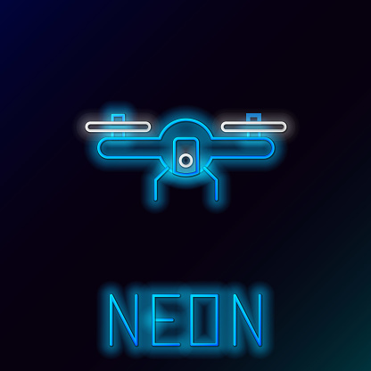 Glowing neon line Drone flying icon isolated on black background. Quadrocopter with video and photo camera symbol. Colorful outline concept. Vector.