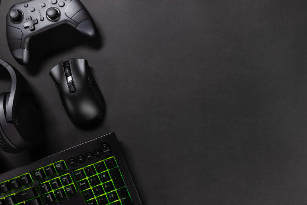 istock Gaming gadgets with green lit keyboard 2145999431