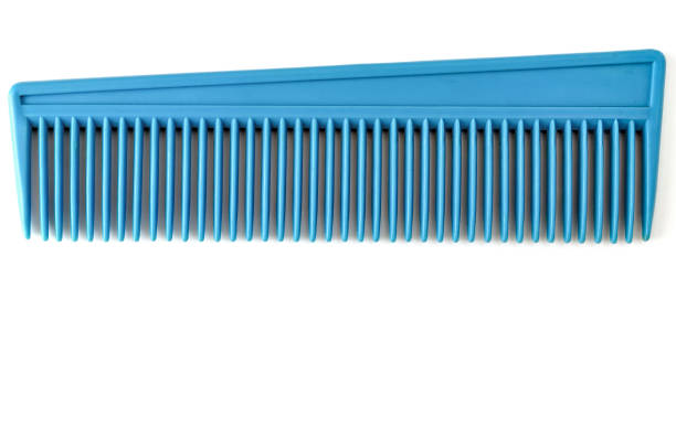 vintage blue comb on white background close up, top view