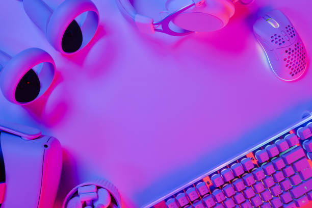 istock Illuminated keyboard and gaming gadgets on desk 2146018688