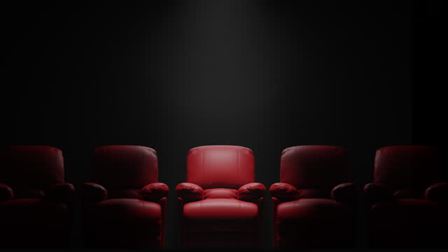 Red sofa Seat in front of black wall with spotlight