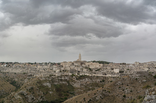 Matera, Italy. UNESCO World Heritage Site. Matera is a city located on a rocky outcrop in Basilicata, in Southern Italy. It includes the area of the Sassi, a complex of Cave Houses excavated in the mountain