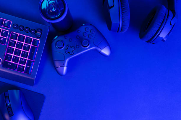 istock Purple lit keyboard by various gadgets and copyspace 2146038835