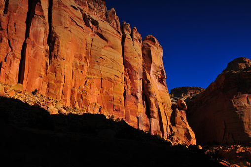 Sunrise on the spectacular geological layers of the Scenic Drive of Capitol Reef National Park, Utah, Southwest USA.