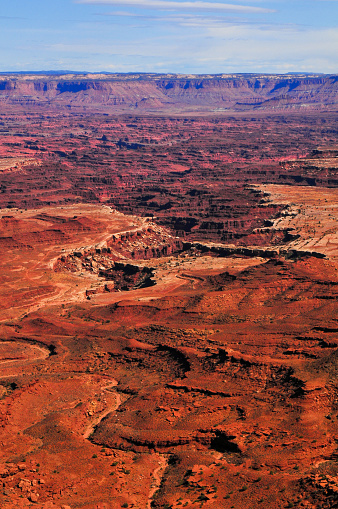 A bird's-eye view of the harsh, eroded canyon lanscape of the Colorado Plateau from the Mesa Arch viewpoint, Canyonlands National Park, Moab, Utah, Southwest USA.