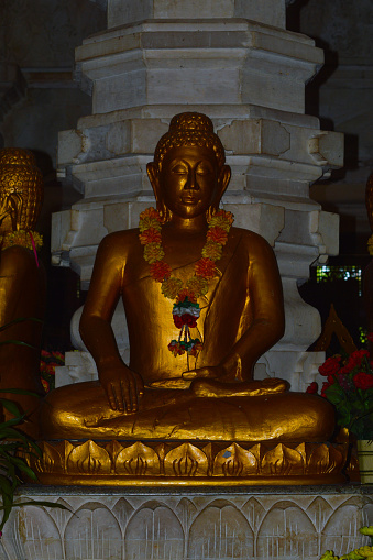 Portrait View Of Golden Buddha Samadhi Statues On The Altar Inside The Building Of Buddhist Temple