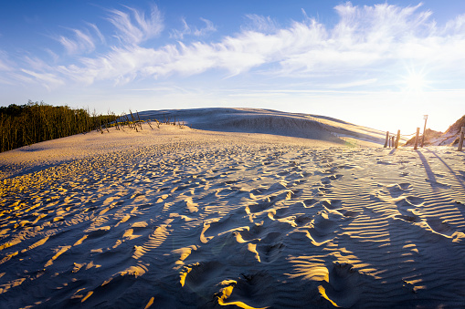 Holidays in Poland - Sunset over desert dunes in Slowinski National Park near Leba on the Baltic sea