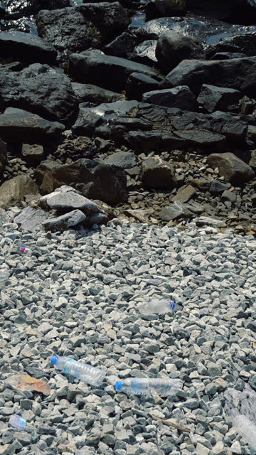 Plastic bottle and garbage on the beach