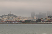 A foggy view of Telegraph Hill, the Coit Tower and Downtown San Francisco