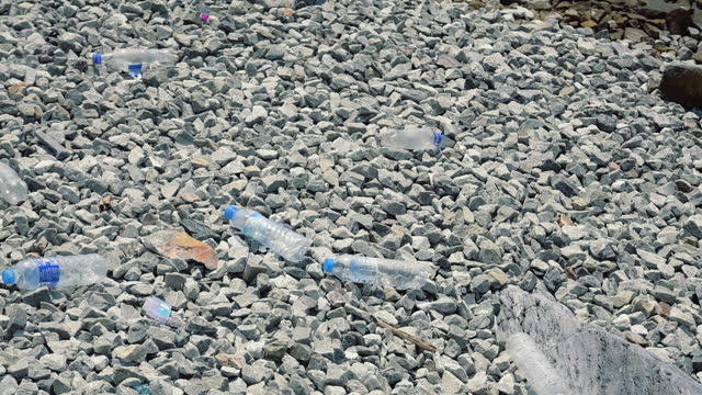 Plastic bottle and garbage on the beach