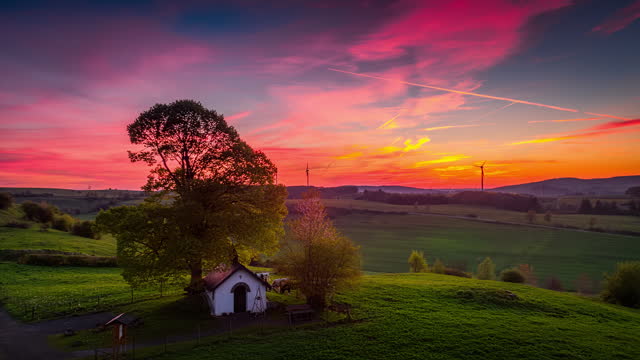 Germany countryside at sunset with fields and a small chapel