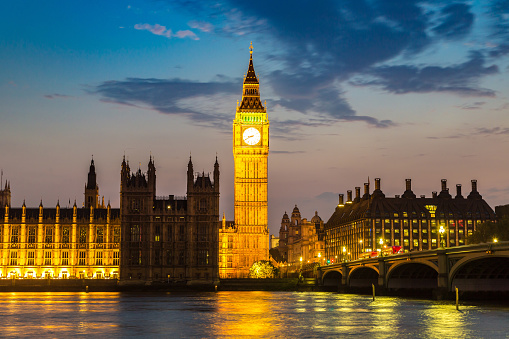 View at The Big Ben, the Houses of Parliament and Westminster bridge in London in a beautiful summer night, England, United Kingdom