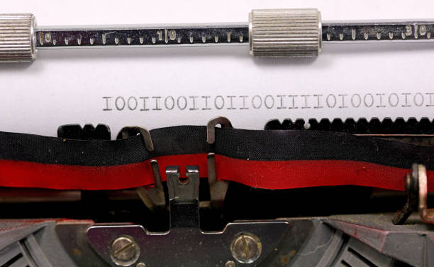 istock Binary sequence of zeros and ones written in black ink on a white paper with a typewriter 2146267290