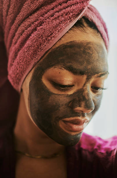 istock Glowing Beauty: Woman with Charcoal Face Mask 2146317625