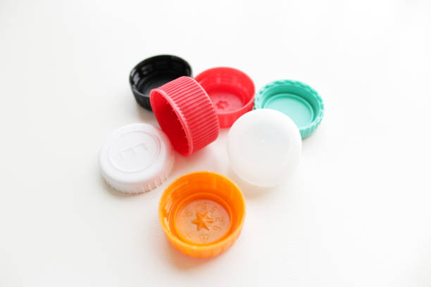 istock Bunch of multi color plastic bottle lids on white background. 2146326059