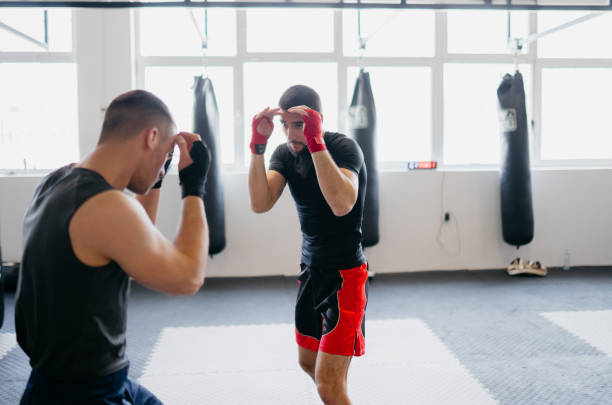 istock Two MMA fighters training in a gym 2146411954