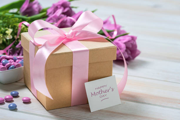 istock Mother's Day concept with brown gift box, candies and tulips 2146458547