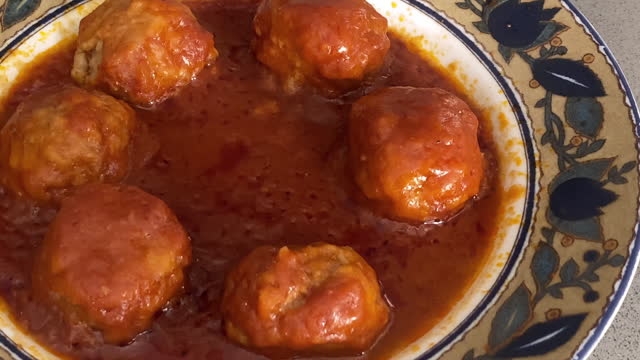 Plate with meatballs and tomato sauce