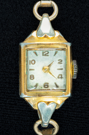 Vintage gold-tone  Manual Wind up lady wrist watch with gold numerals, The watch face is worn and thought to be about early 1900s