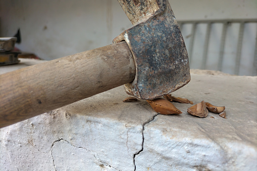 An example of a bad idea is to crack apricot nuts with a hammer on a ceramic surface, which leads to breakage, cracks, and can even injure a person.