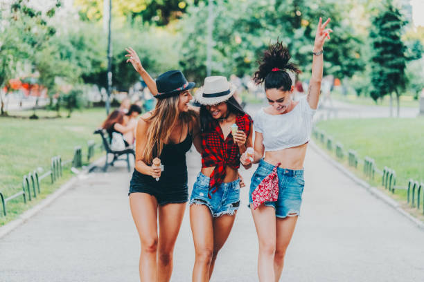 istock Happy girls eating ice-cream and having fun 2146540090