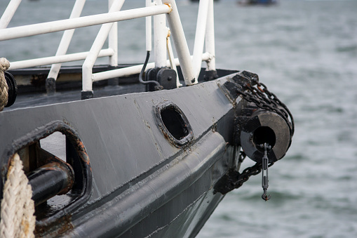 The close up image of Anchor rope holes on the bow of the ship