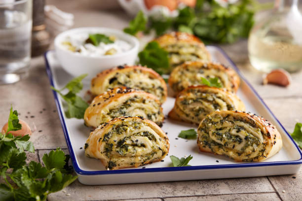 istock Puff pastry Pizza rolls with spinach, cheese, feta and garlic. 2146674429