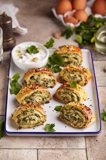 istock Puff pastry Pizza rolls with spinach, cheese, feta and garlic. 2146674430