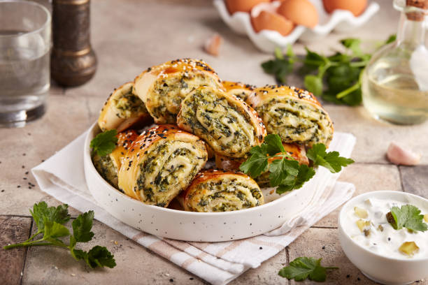 Puff pastry Pizza rolls with spinach, cheese, feta and garlic.