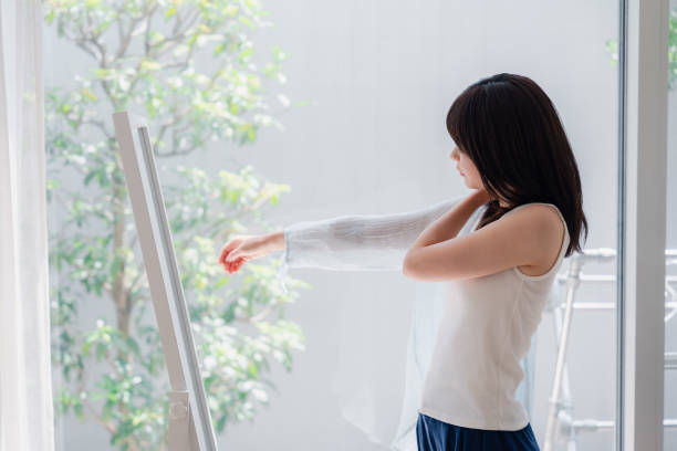 Young woman changing clothes at home