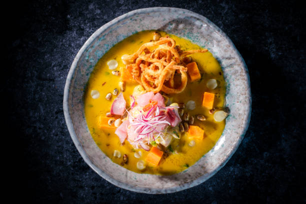istock Pumpkin puree soup on black table 2146683334