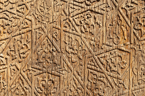 Arabic pattern, close up background texture of an old wooden wall