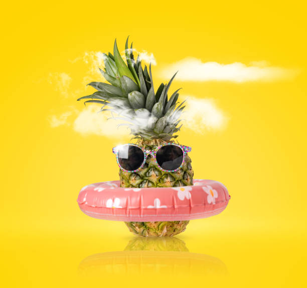istock Pineapple with ring float and sunglasses Creative summer beach holiday 2146689564