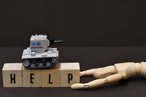 Images of war sacrifice with dolls and tanks