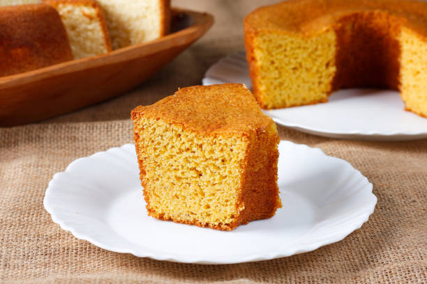istock corn cake on white plate on rustic wooden table. Typical Brazilian party food. 2146699086