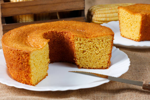 istock corn cake on white plate on rustic wooden table. Typical Brazilian party food. 2146699087