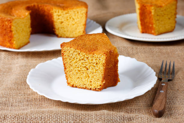 istock corn cake on white plate on rustic wooden table. Typical Brazilian party food. 2146700155