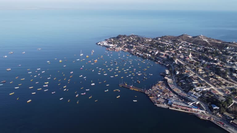 Flyover waterfront pier, marina in small fishing village, Tongoy Chile