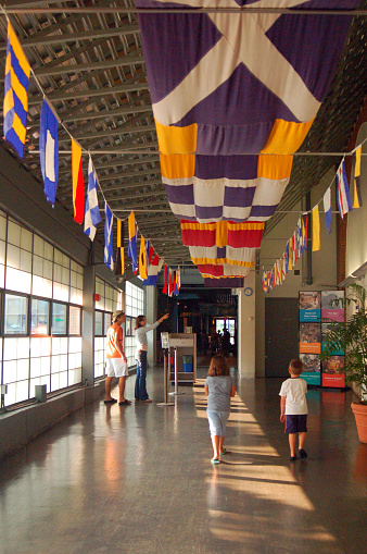 Norwalk, CT, USA July 27 Colorful Nautical flags hang from a ceiling, recalling the maritime heritage of Norwalk, Connecticut