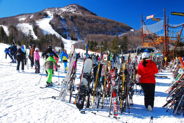 Friends skiing. Snow skiers skiing at sunny ski resort, sunset Dolomites mountain in Italy.